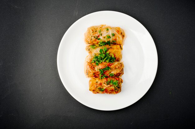 Cabbage dolma with green herbs.