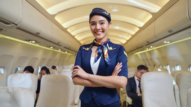 Cabin crew or air hostess working in airplane