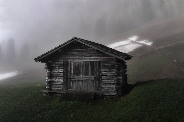 Cabin on Grass Field