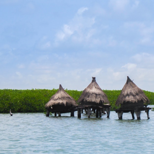 Free photo cabins in the middle of a lake