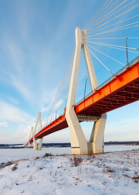 cable-stayed bridge across frosty river