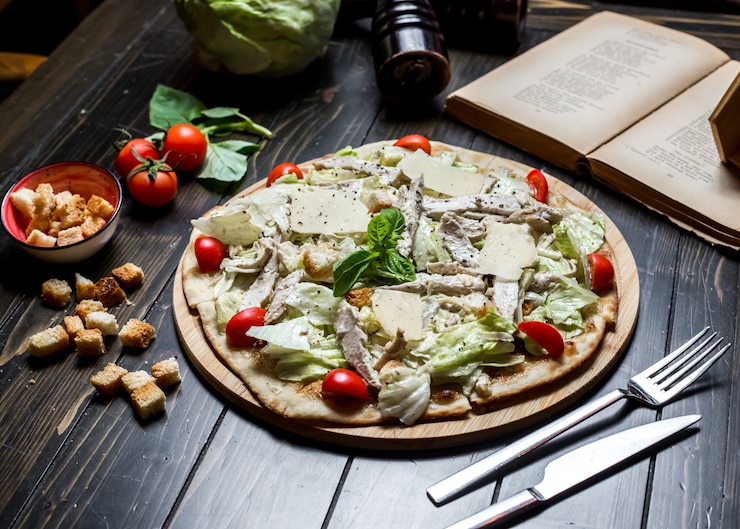 Free Photo caezar pizza chicken tomato parmesan crackers basil side view