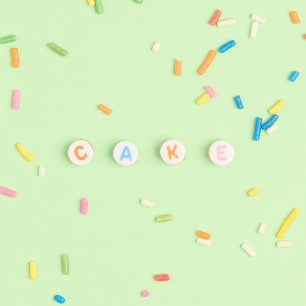 Cake beads text typography on green