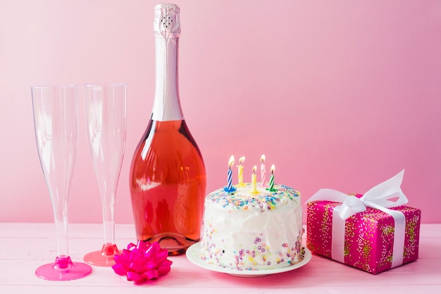 Free photo cake and bottle of champagne