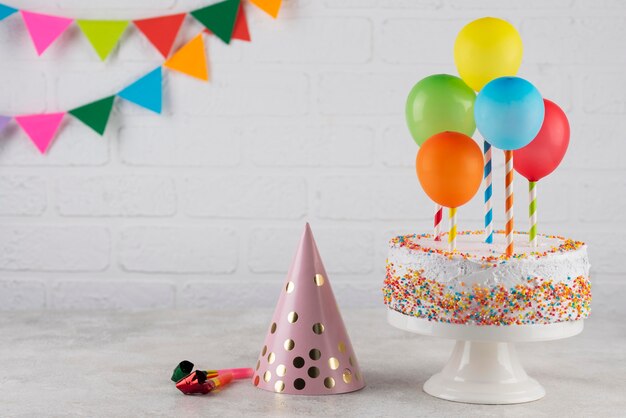 Cake and colorful balloons arrangement