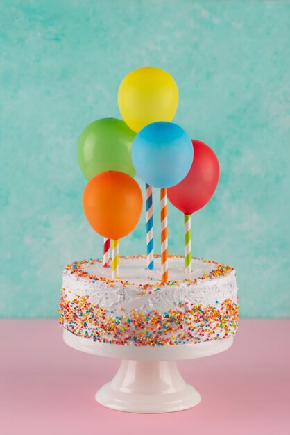 Cake and colorful balloons assortment