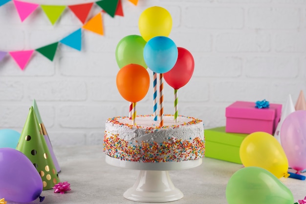 Cake and colorful balloons