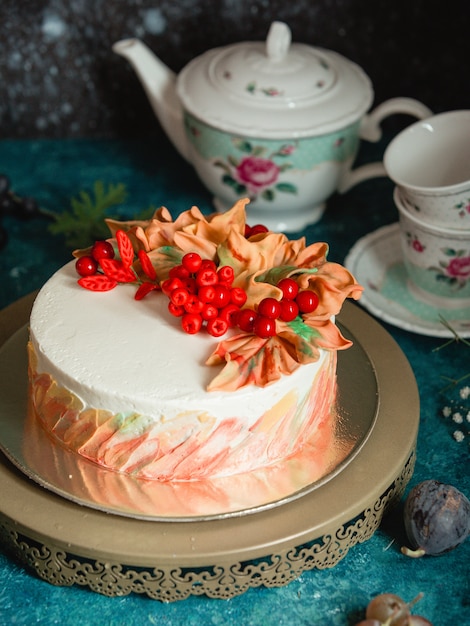 Cake decorated with berries and cream