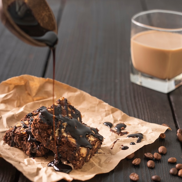 Cake glazing with glass of coffee