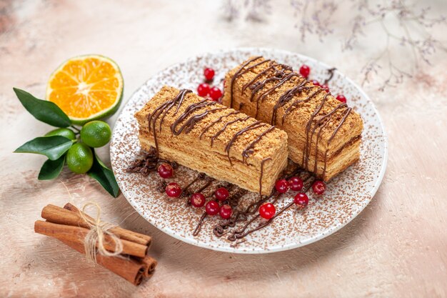 cake slices with berries on grey