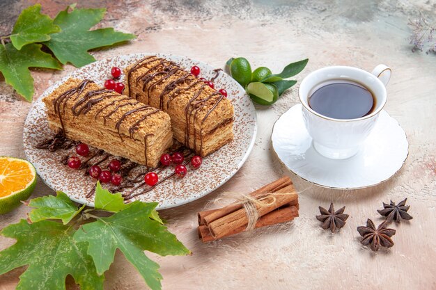 cake slices with red berries on grey