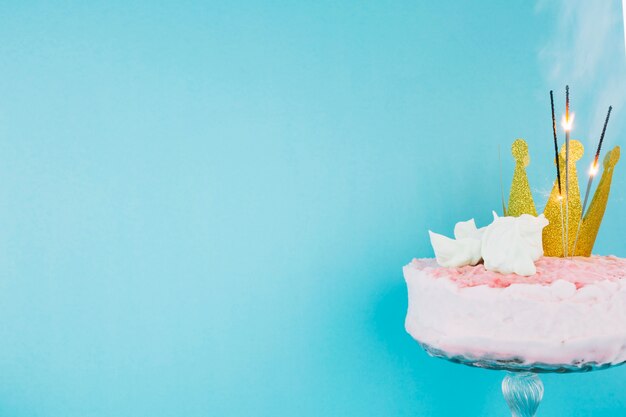 Cake with crown and flaming sparklers