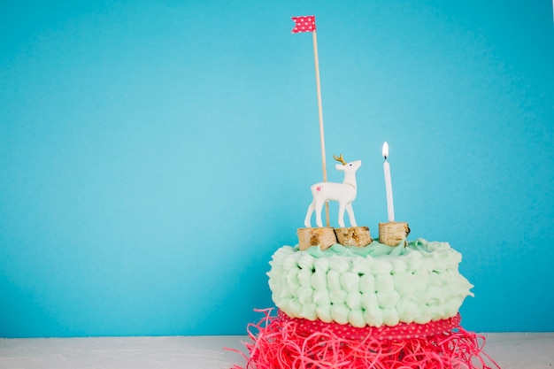 Cake with deer flag and candle