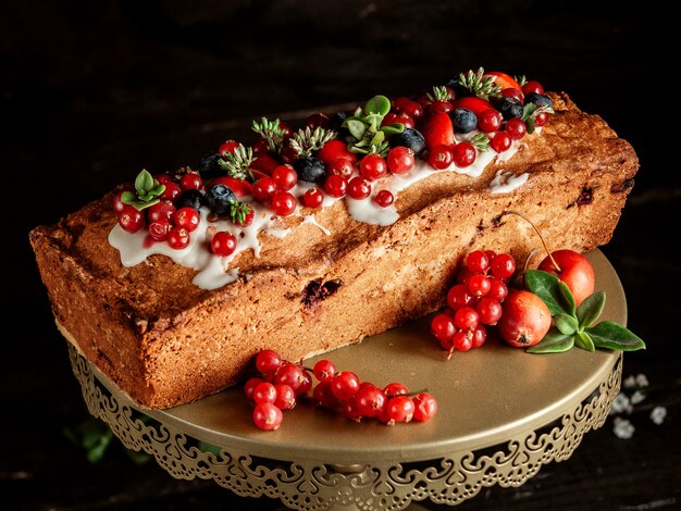 Cake with jam blueberry red currant and cream