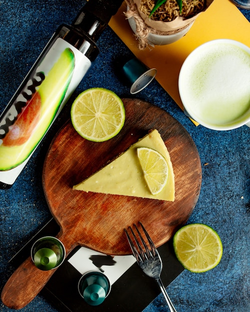 Cake with lemon on cutting desk