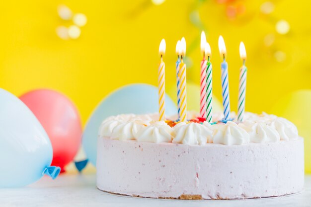 Cake with lighting candles