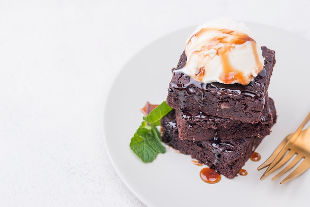 Cake with mint on plate with cutlery