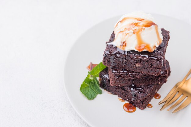 Cake with mint on plate with cutlery