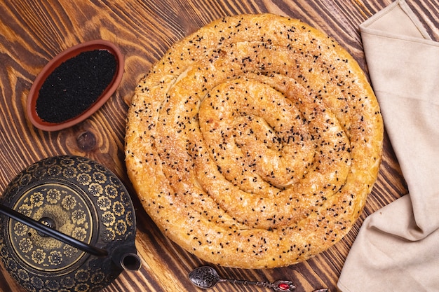 Cake with sesame tea pot top view