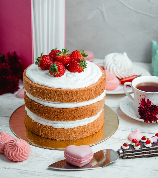 Cake with whipped cream and strawberries