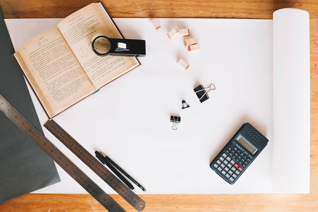 Calculator and book on unrolled paper