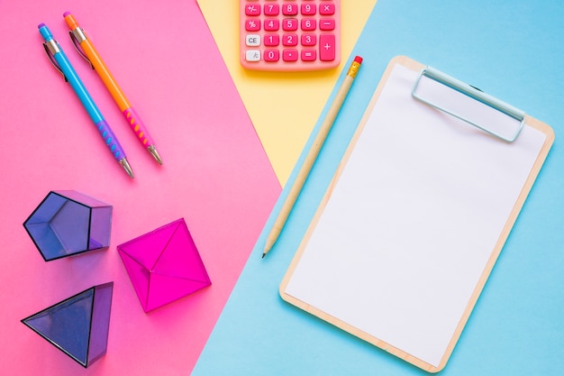 Calculator and geometric shapes near school stuff