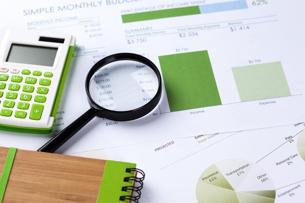 Calculator and magnifying glass on the table