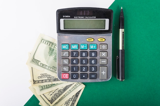 Calculator with money on table