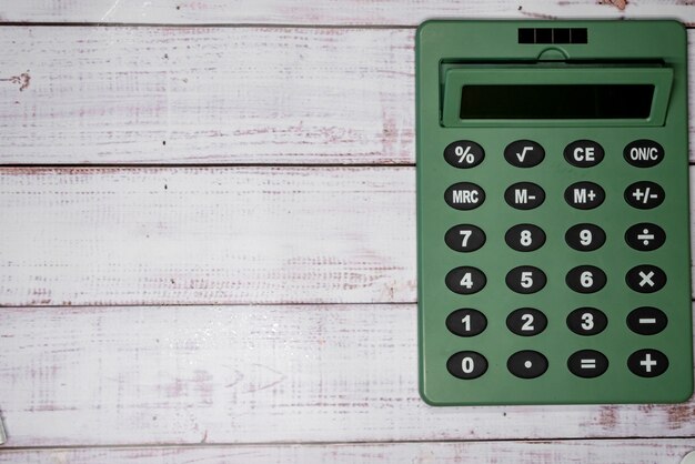 Calculator on wooden boards