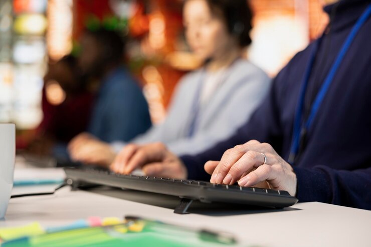 Free Photo call center agent typing on pc keyboard assisting customers through live chat