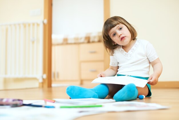 calm  child sketching on paper