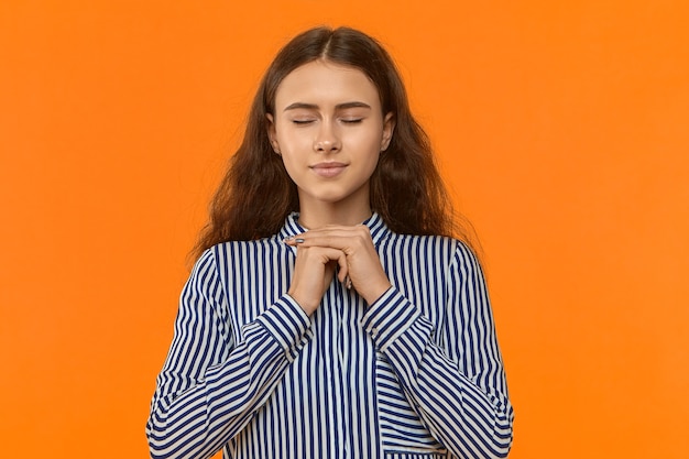 Free photo calm peaceful young businesswoman feeling relaxed