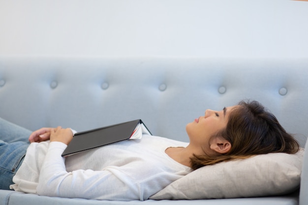 Calm relaxed girl enjoying weekend at home