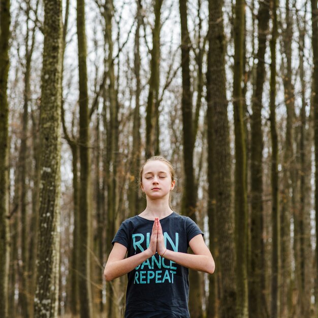 Calm teenager doing yoga