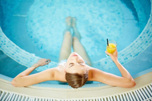 Calm woman in hot tub