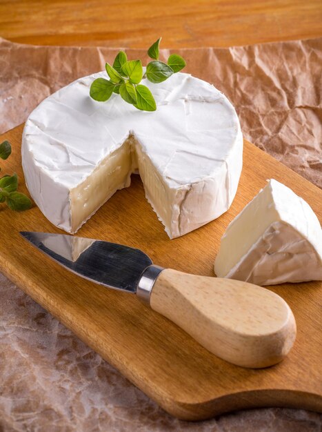 Camembert cheese on wood