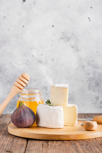 Camembert slice on top of roll with honey