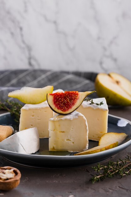 Camembert slices with pear and fig