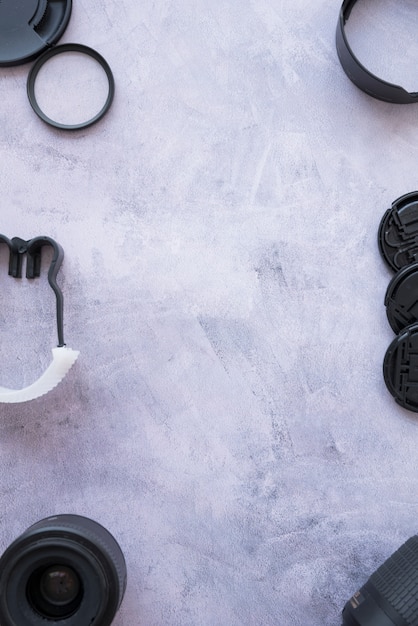 Camera accessories arranged on concrete background