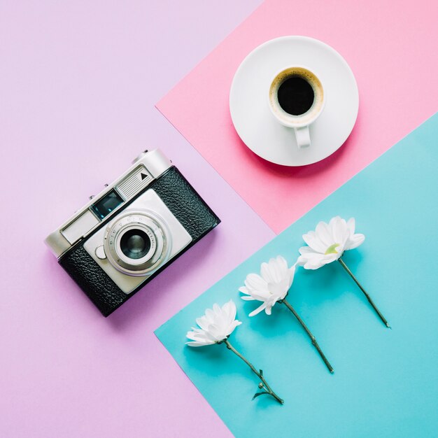 Camera, coffee and flowers