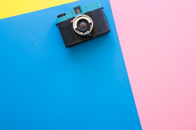 Camera on colorful background