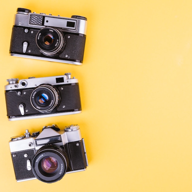 Free photo camera line on yellow background