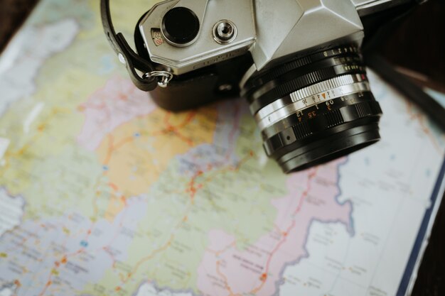 Free photo camera and map of travelers.