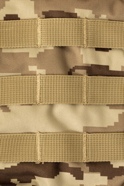 Camouflage textured military background close up