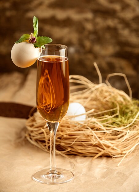 Campagne glass decorated with eggshell, mint leaves and dried rose