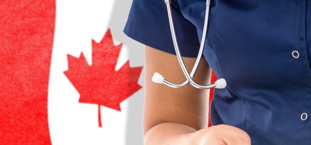 Canada flag female doctor with stethoscope, national healthcare system