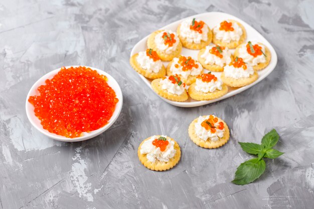 Canape with red caviar for party.