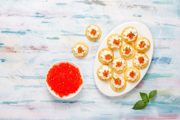 Canape with red caviar for party.