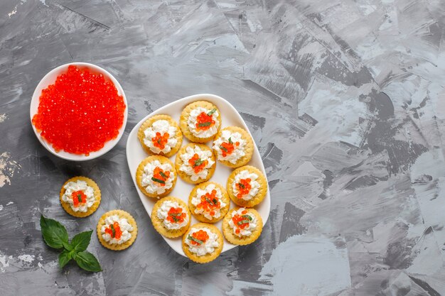 Canape with red caviar for party.