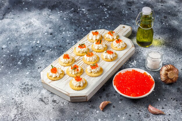 Canape with red caviar for party.